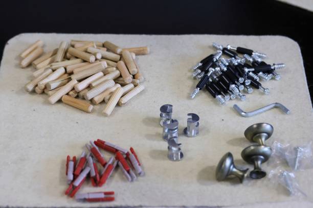 istock Hardware for assembling an ottoman. Laid out for convenience. Close-up view. Oblique Angle. 2204154036