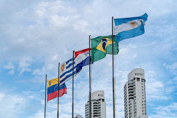 Mercosur flags flying high. Several flagpoles with Mercosur flags. Latin American flags. South American flags.