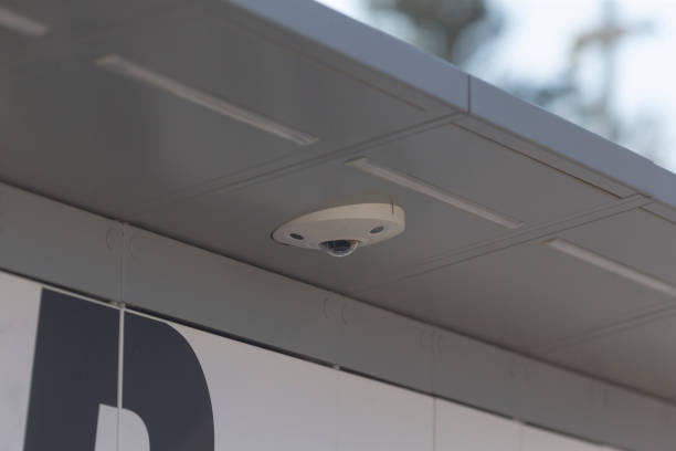 istock A camera has been securely mounted on the side of a tall building 2204157838