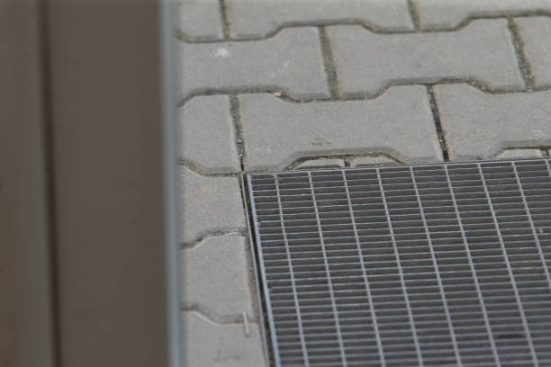 istock This is a closeup view of a metal grate situated on a brick sidewalk 2204159424