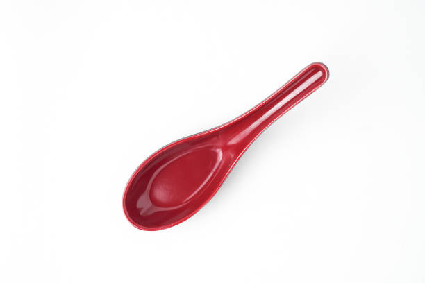 Empty red colored chinese soup spoon. Isolated on white background. Flat Lay Setup