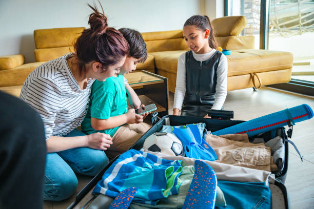 istock Family with two kids preparing for holiday 2204165673