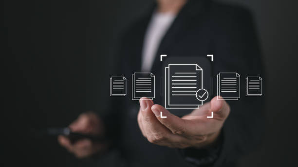istock A person holds a smartphone while virtual icons of documents with a checkmark appear, symbolizing quality assurance, client focused services, and efficient document handling in a digital workflow. 2204167313