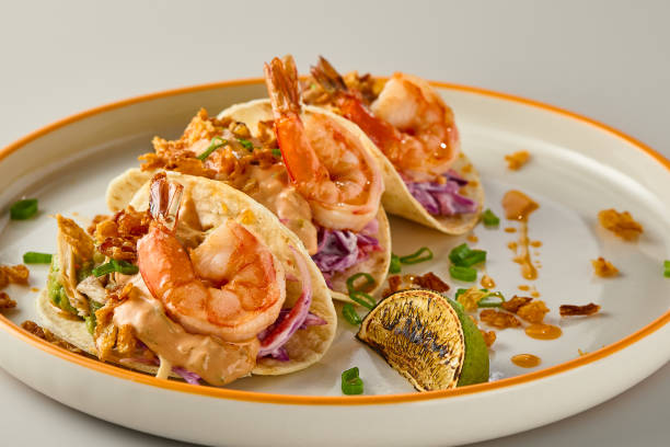 istock Vibrant Shrimp Tacos on Elegant Plate with Citrus Accent 2204169019