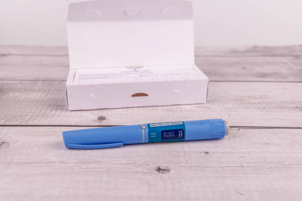 istock This photo features a semaglutide pen and its box on a white-painted wooden table, symbolizing medication and health management 2204174930