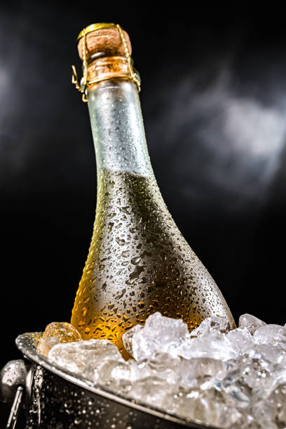 istock Bottle of sparkiling wine in bucket with crushed ice. 2204176455