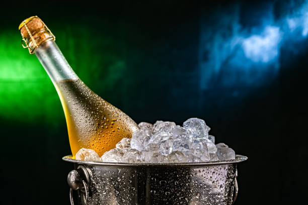 istock Bottle of sparkiling wine in bucket with crushed ice. 2204176470