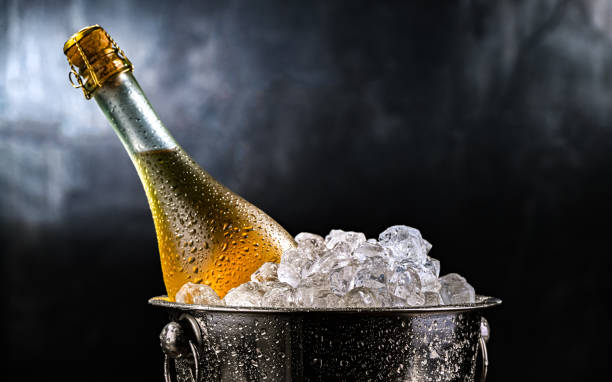 istock Bottle of sparkiling wine in bucket with crushed ice. 2204176485