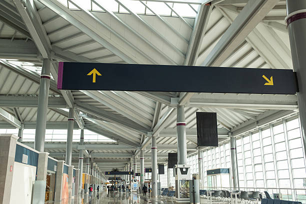 istock airport corridor with flight departure gate sign 2204177007