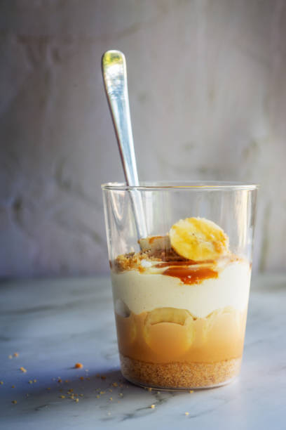istock homemade no-bake banoffee pie in a glass cup. 2204178935