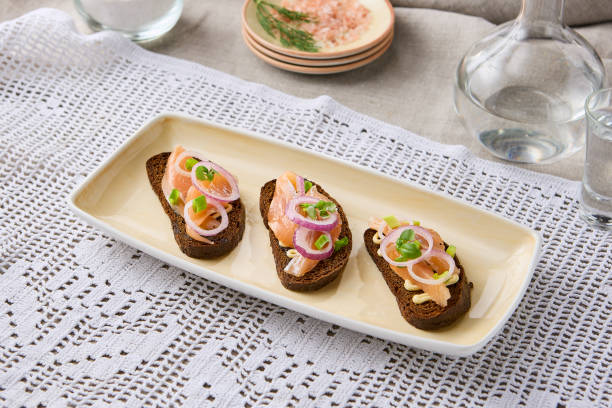 istock Elegant Borscht Bread Toasts with Herring A Rustic Culinary Delight in Subtle Natural Lighting 2204179089