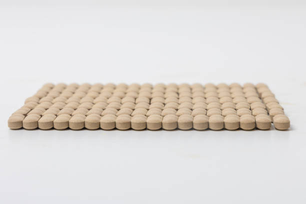 Much medical pills and drugs in white package on the red background. Healthcare concept.