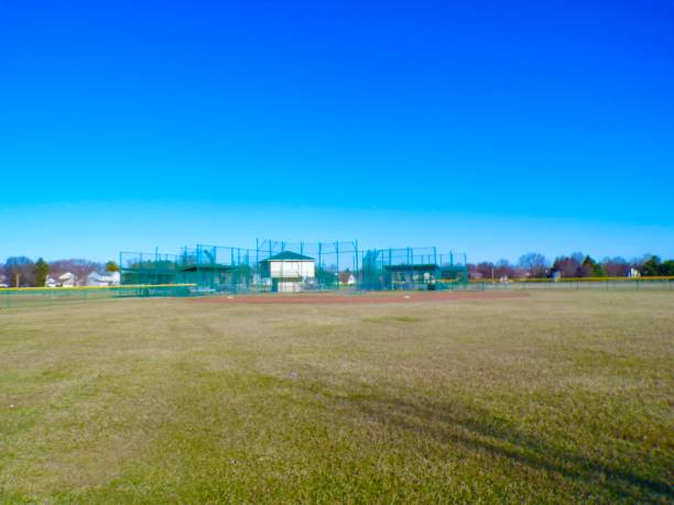 istock Baseball field on sunny day with blue sky. 2204182096