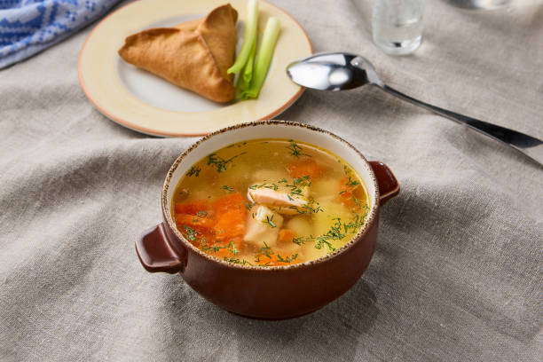 istock Delicious Fish Soup with Vibrant Ingredients and Artistic Presentation 2204185325