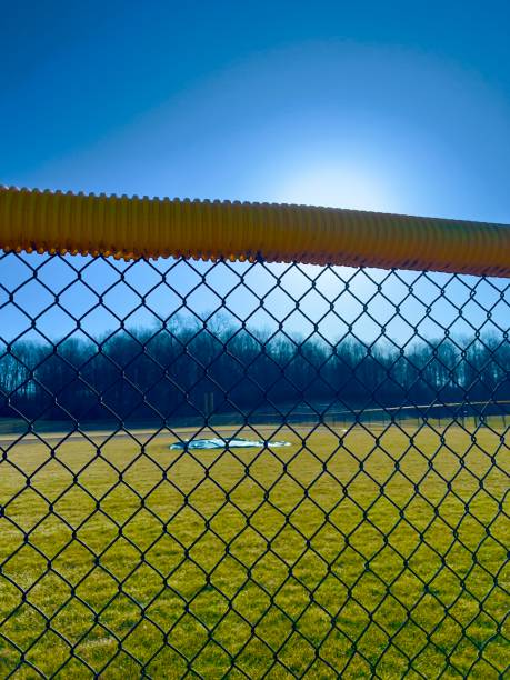 istock Baseball field on sunny day with blue sky. 2204185548