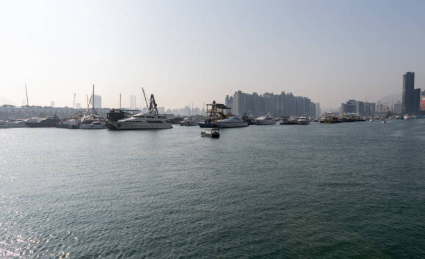 Hong Kong. China- 02.15.2025. A general view of the Kwun Tong Typhoon Shelter on a sunny day with a large number of boats and yachts moored inside.