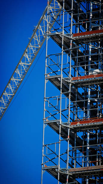 istock scaffolding of a modern glass house 2204189170