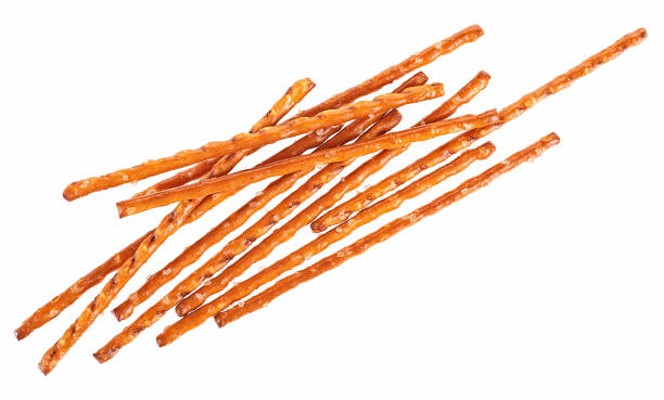 istock Breadsticks straws with salt isolated on a white background, top view. Bread sticks made of wheat flour. Salty snacks. 2204189594