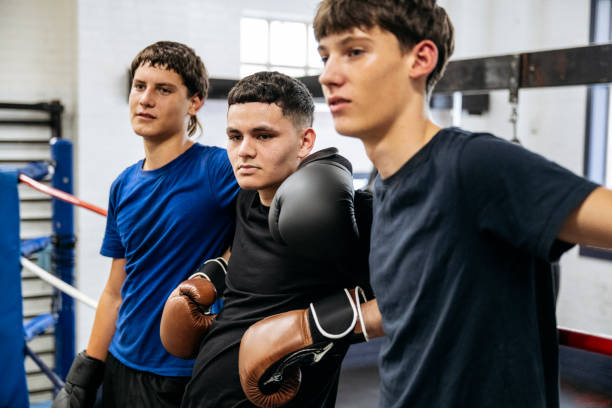 istock Young male boxers leaning on the ropes 2204191156