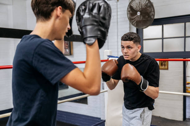 istock Teenage boxers training with focus mitts 2204191171
