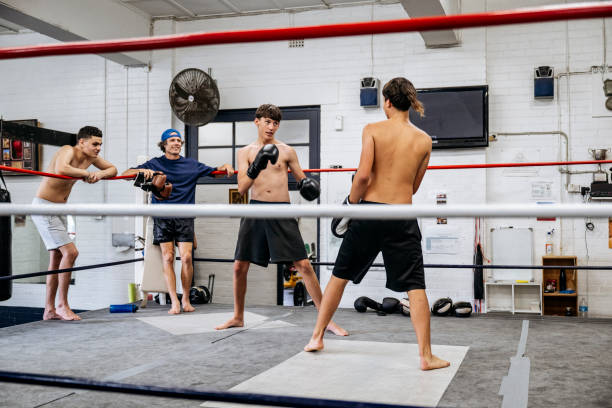 istock Young fighters sparring at boxing club 2204191384