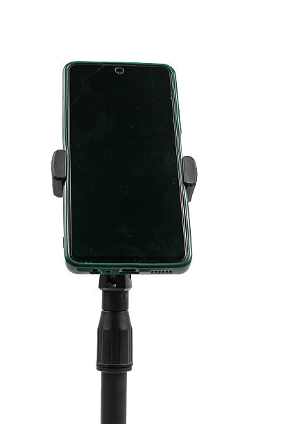 istock mobile phone mounted on monopod ready to stream online, isolated on white background 2204191663