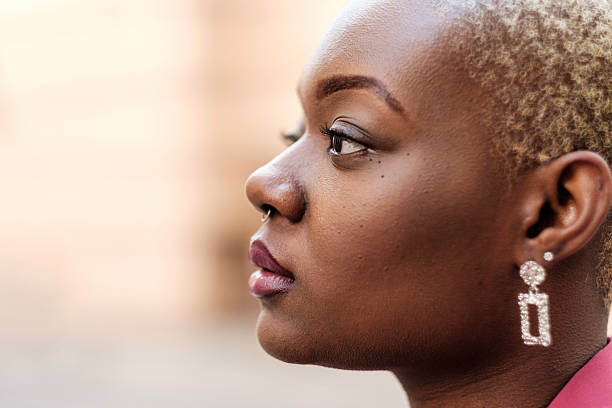 istock Young black woman showing confidence and determination while looking away 2204192480