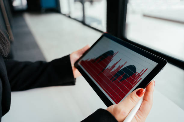 Asian business woman looking at tablet