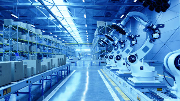 istock Robotic Arms in a Modern Warehouse with Blue Toned Lighting 2204195195