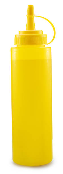 istock Yellow plastic dispenser bottle for mustard or other sauce isolated on white background. File contains clipping path. 2204196104