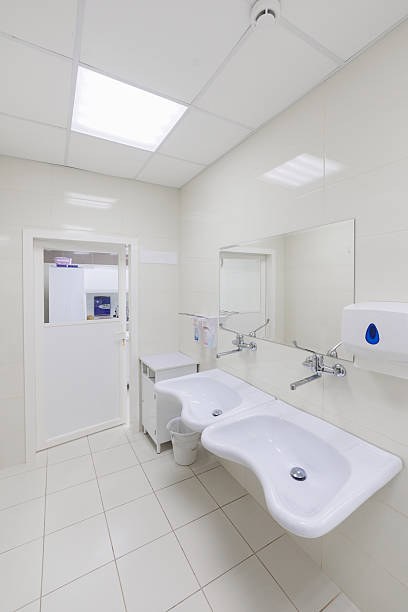 istock This modern restroom interior features dual sinks and a clean, contemporary design aesthetic 2204196177