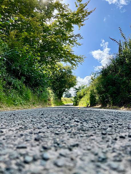 istock Low-angle view of a rural road 2204196435