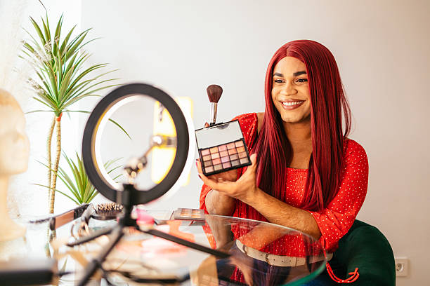istock Transgender influencer showing makeup palette while recording video 2204196954