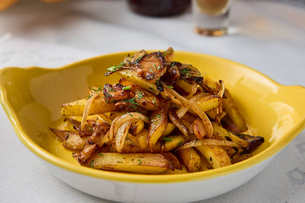 istock Golden Fried Potatoes with Onions in Warm Tones A Rustic Culinary Delight 2204196960