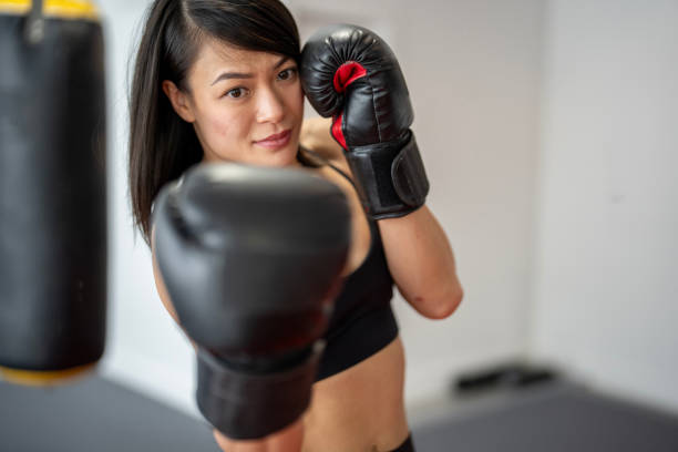 istock Confident Female Muay Thai Boxer Facing the Camera 2204197251