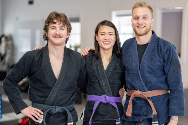 Group Portrait of Happy Jiu Jitsu Practitioners in Gi