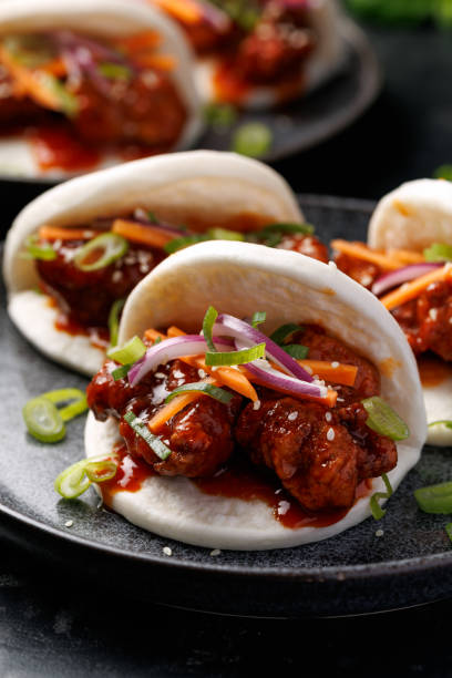 istock Korean Fried Chicken Bao Buns with vegetables. Asian fast food 2204197822