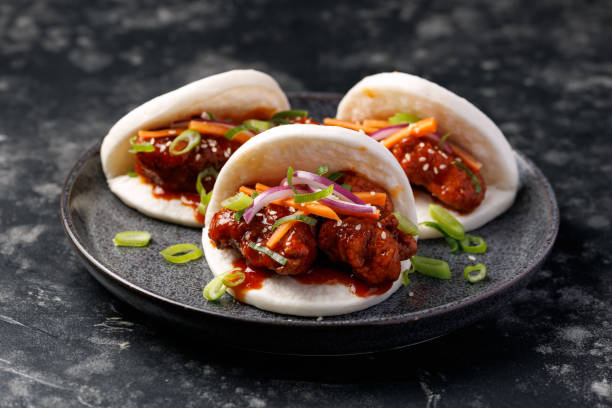 istock Korean Fried Chicken Bao Buns with vegetables. Asian fast food 2204197840