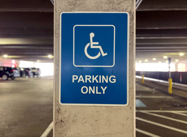 Handicapped parking sign in parking garage.