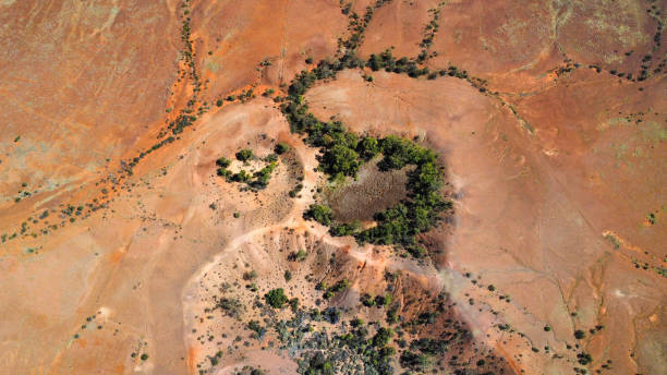 istock Meteorite craters in the Australian outback, seen from above 2204198090