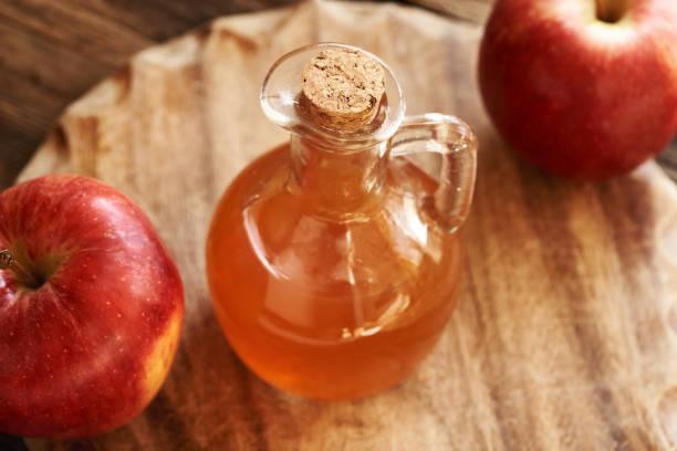 istock Apple cider vinegar in a glass jug 2204198789