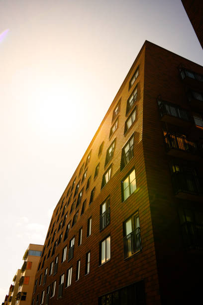 modern apartment building with sun flare.