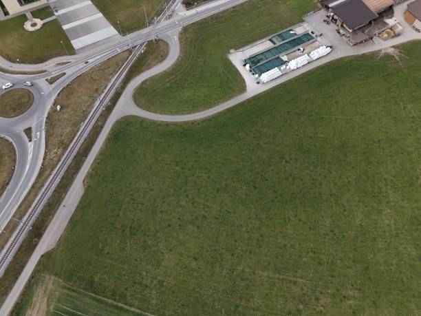istock Aerial view of a road intersection with a roundabout 2204200256