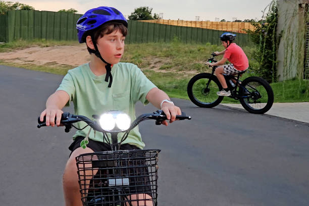 istock Children go on a bike ride 2204205139
