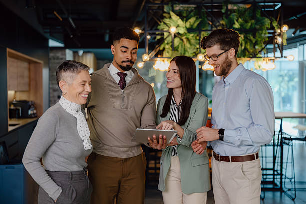 istock Diverse Business Team Discussing Ideas in a Modern Office Setting 2204211580