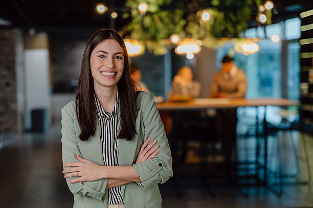 istock Confident Professional Woman Smiling in a Modern Office Setting 2204211703