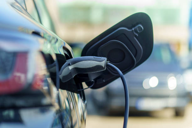 istock Electric Car Charging At Power Station 2204218884