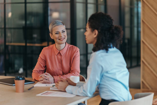 istock Two business person talking in the office 2204219210