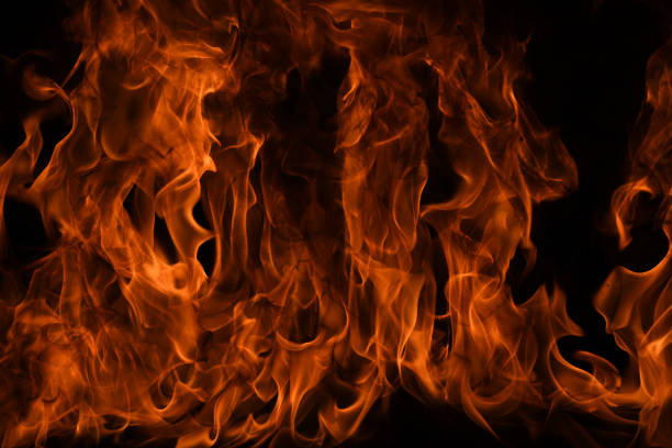 Fire flames isolated on black background. Fire burn flame isolated, flaming burning art design concept with space for text
