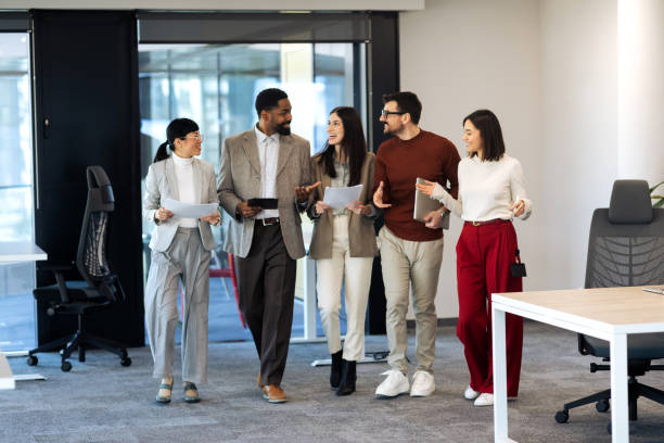 istock Business team walking in the office 2204220660